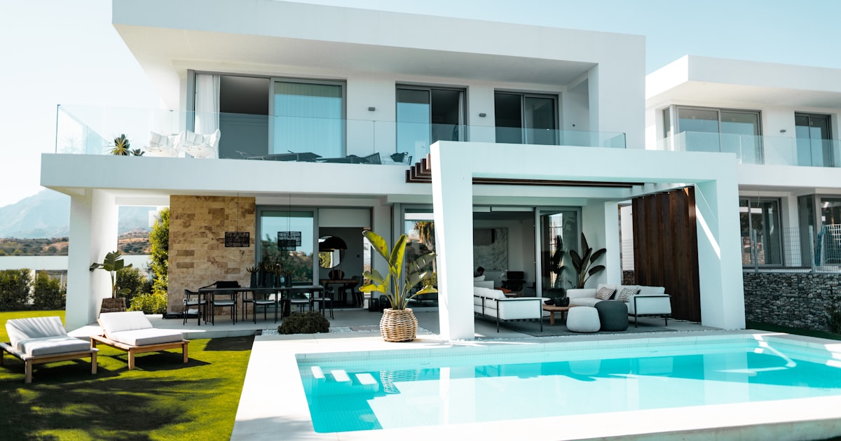 Luxury private villa with infinity pool surrounded by tropical palms in Bali, Indonesia